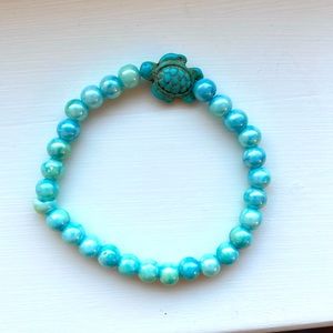 This is a beautiful pearly blue turtle bracelet
